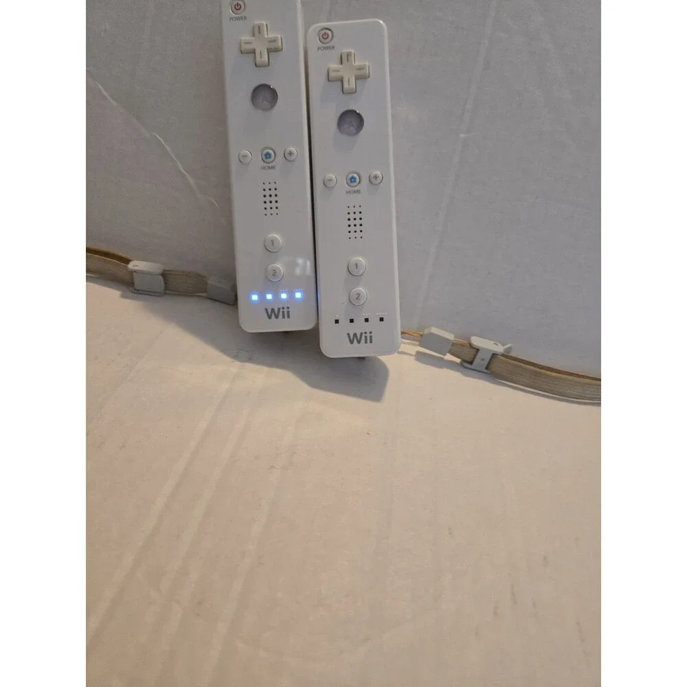 Pair Of Nintendo Wii Remotes With Nunchucks